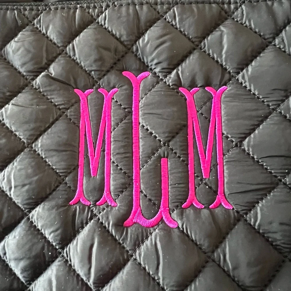 Marleylilly monogrammed black quilted laptop bag with the initials MML